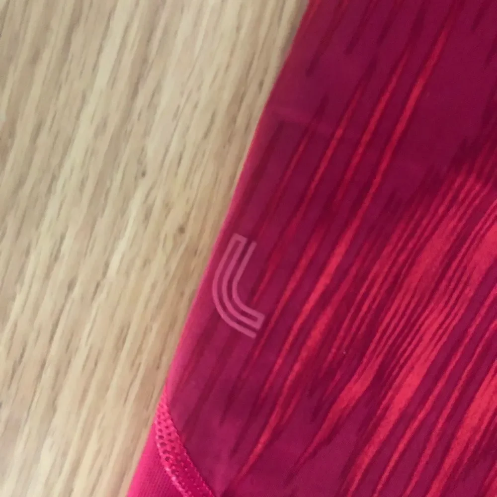 LOLE Pink Mesh Back Zipped Pocket Capri Leggings